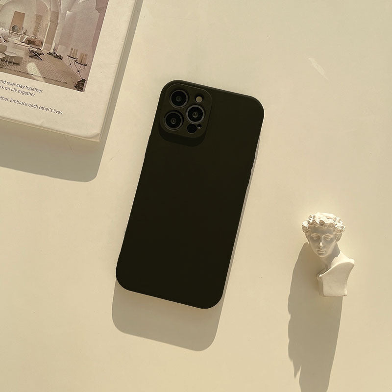 a phone and a book on a table