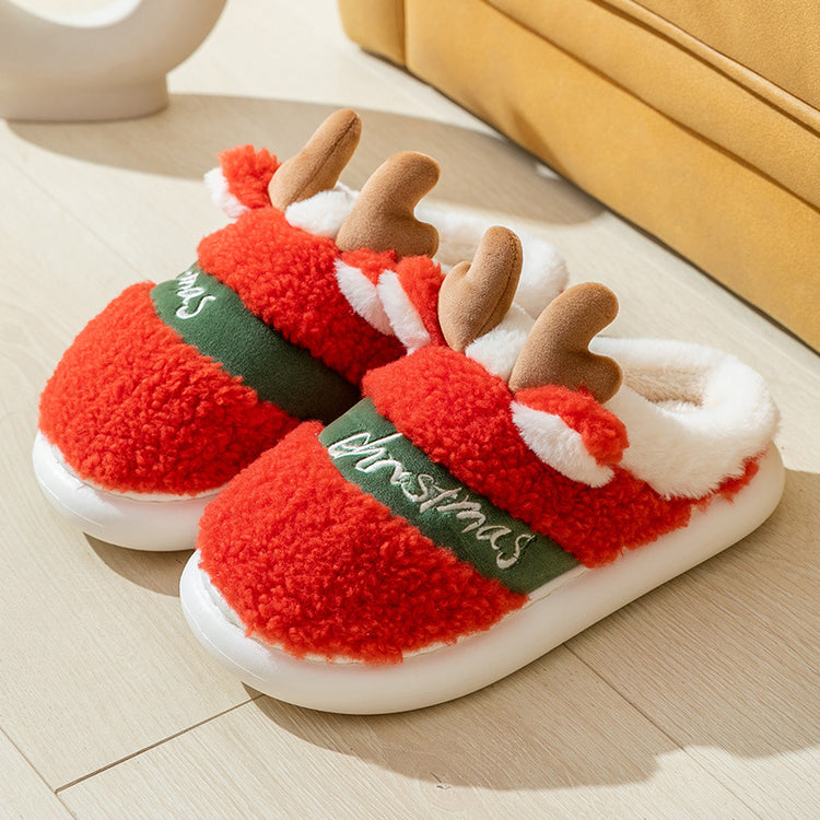 a pair of red slippers with antlers