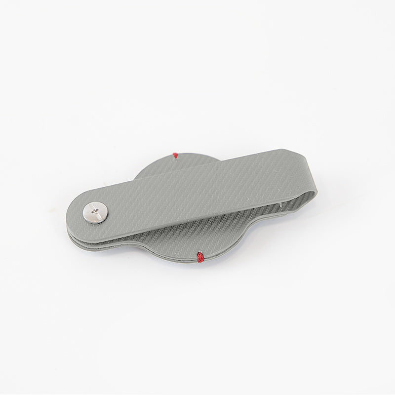 a grey plastic object with a button