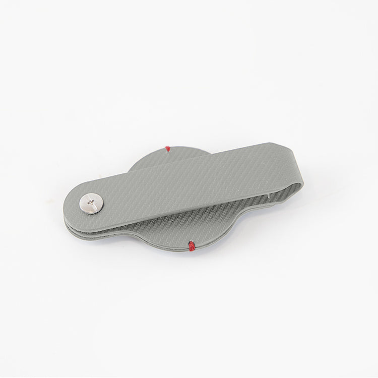 a grey plastic object with a button