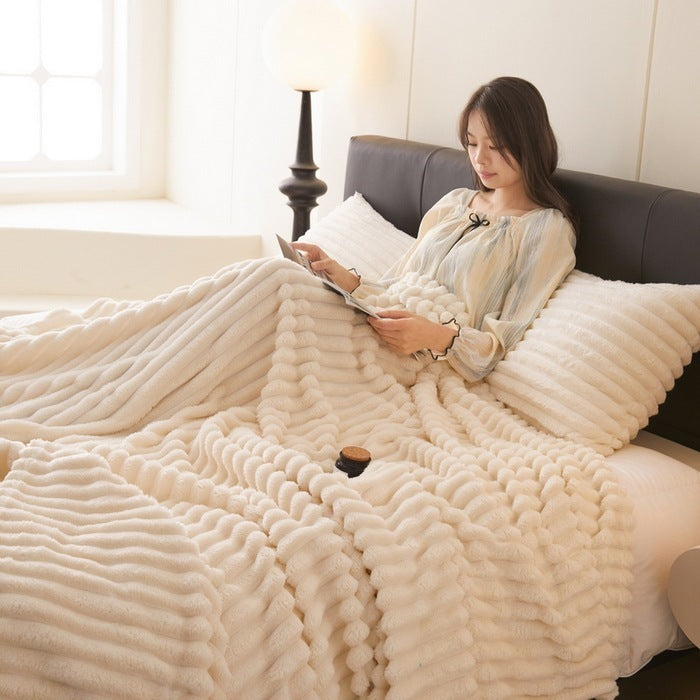 a woman lying in bed reading a book