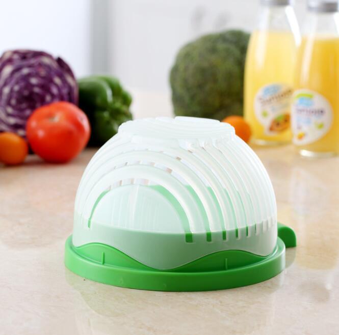 a green and white vegetable cutter