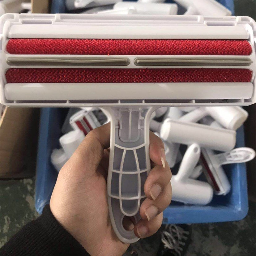 a hand holding a red and white roller
