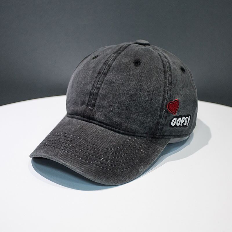 a black hat on a white table