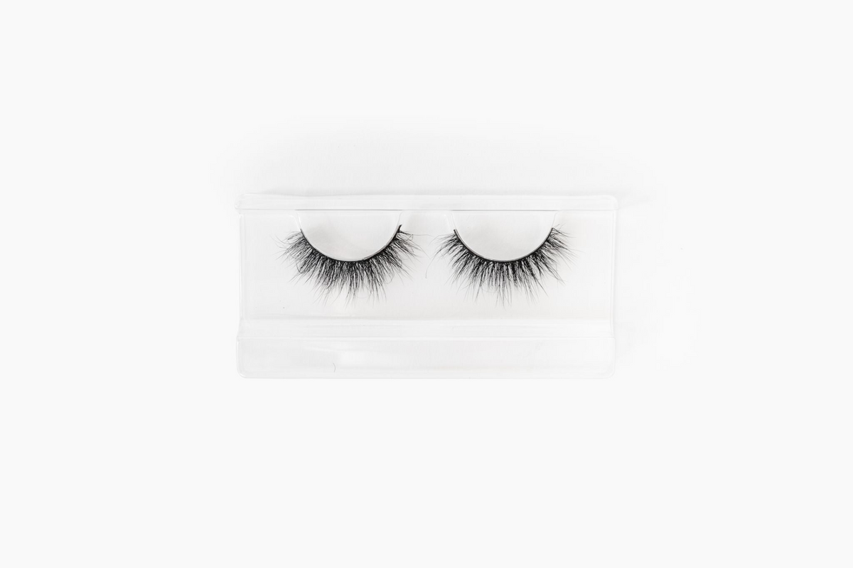 a pair of false eyelashes in a plastic case