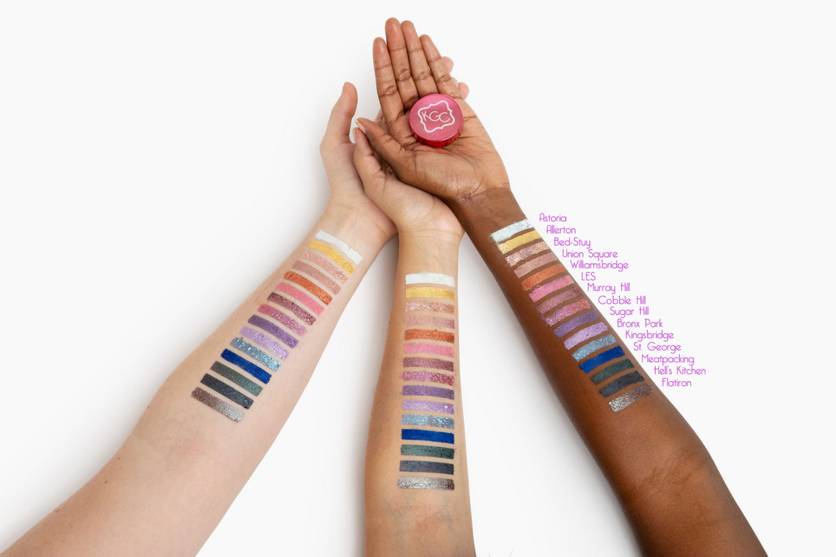 a group of hands with different colored makeup swatches