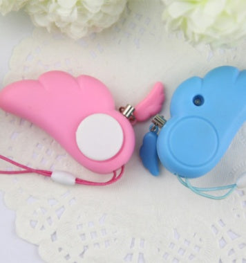 a pair of whistles on a doily