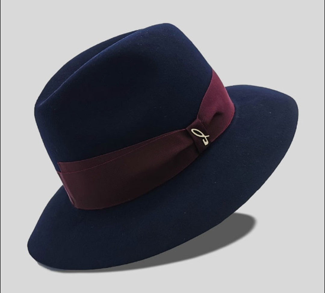 a blue hat with a red ribbon
