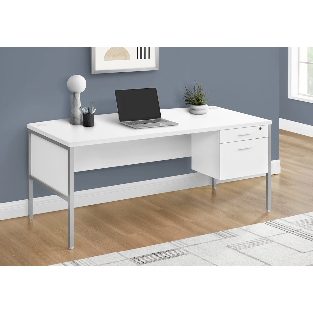 a white desk with a laptop on it