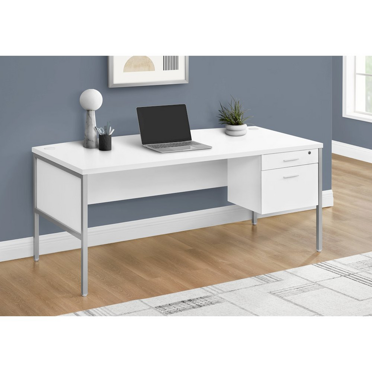 a white desk with a laptop on it