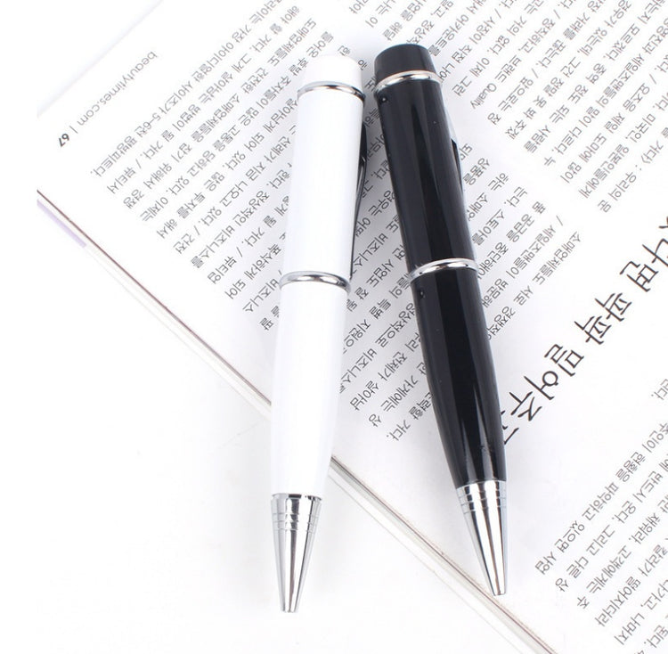 a black and white pen on top of a book