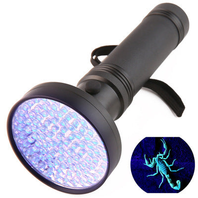 a black flashlight with a black handle and a black handle