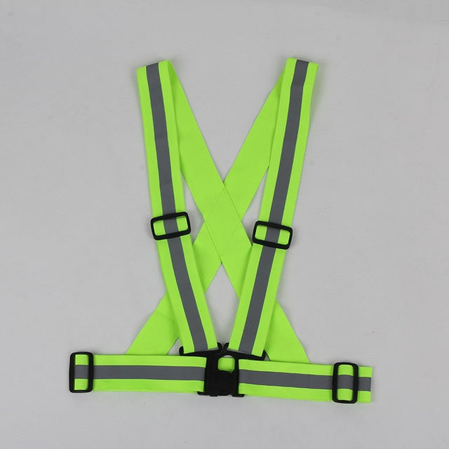 a green safety vest with grey stripes