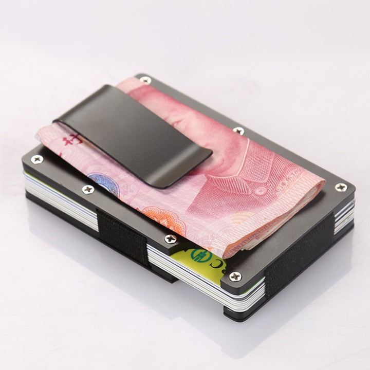 a black and silver card holder with money and a black clip