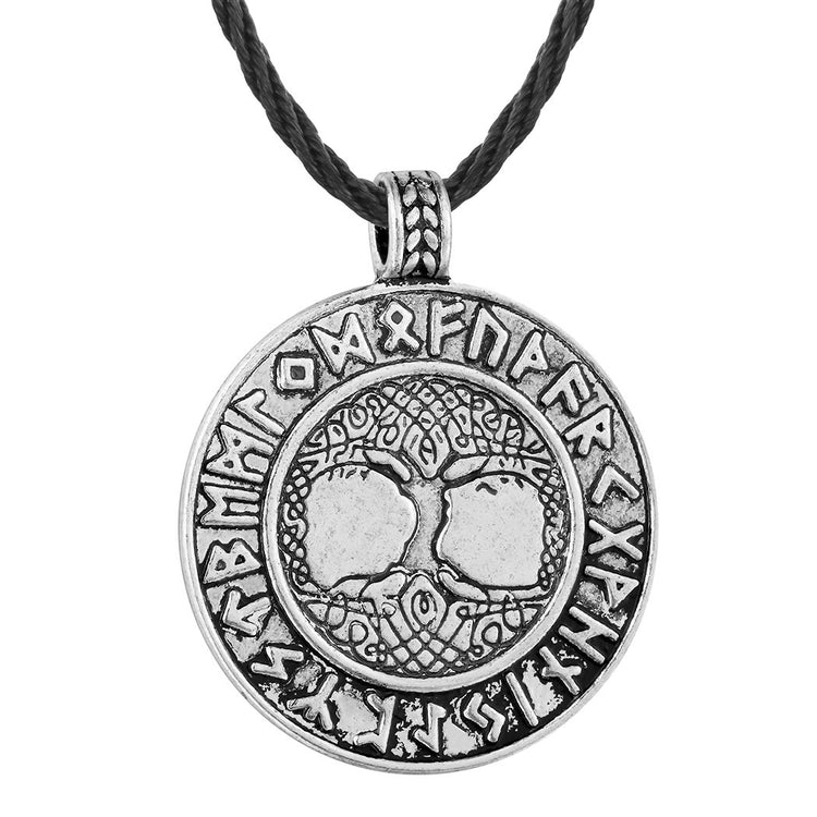 a silver medallion with a black rope