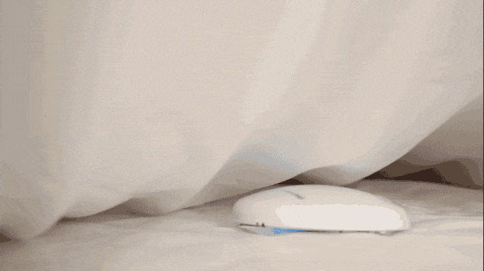 a computer mouse under a blanket