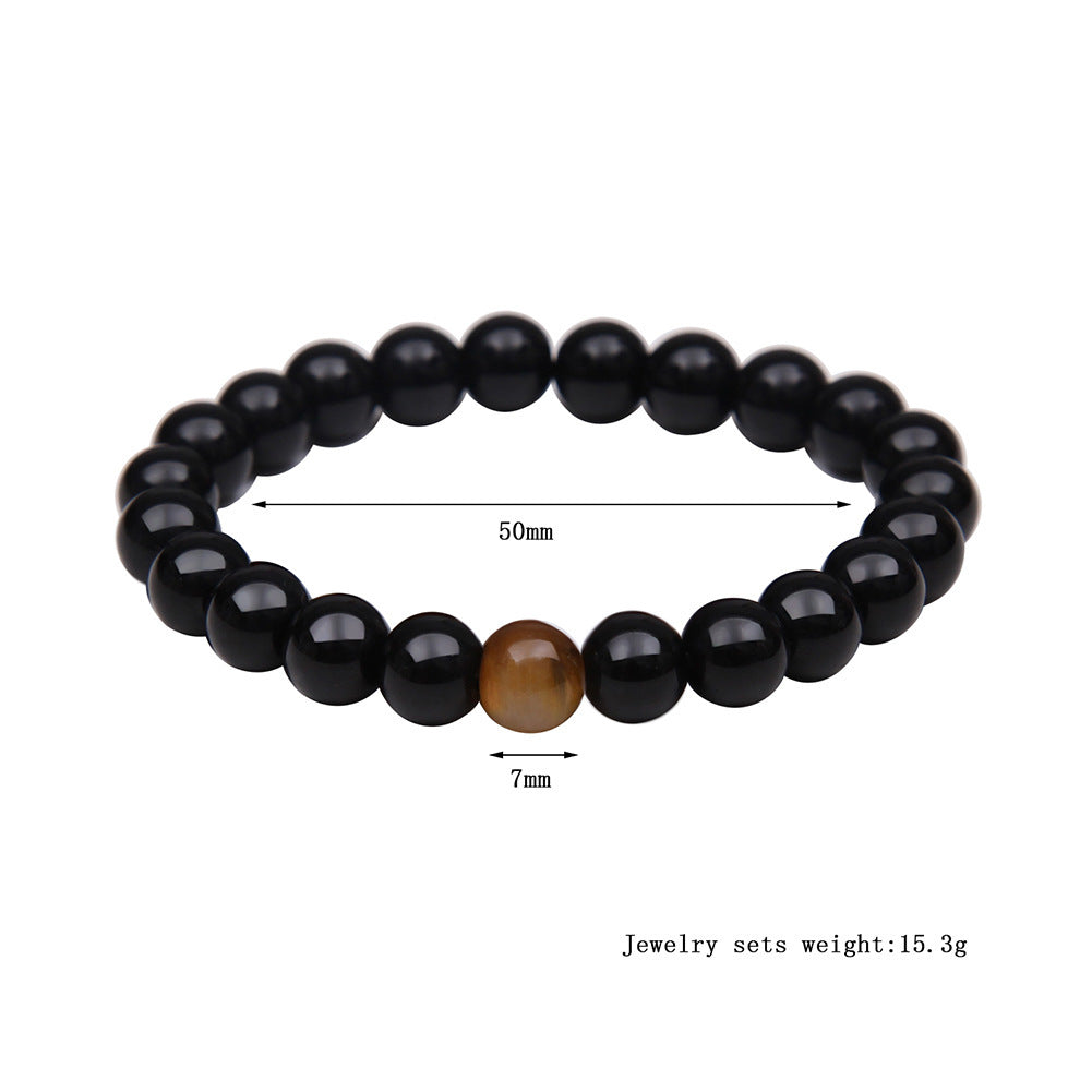 a bracelet with a brown bead and a brown bead