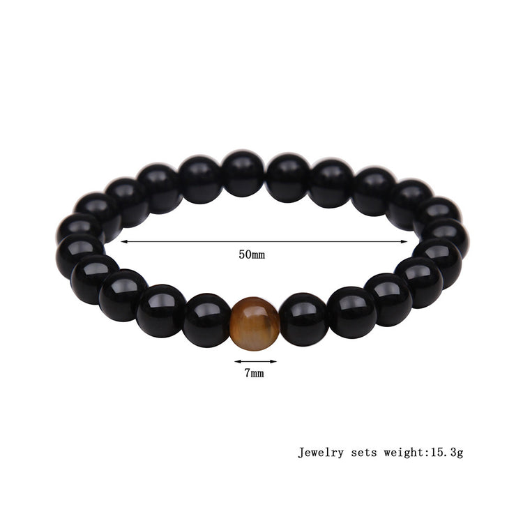 a bracelet with a brown bead and a brown bead