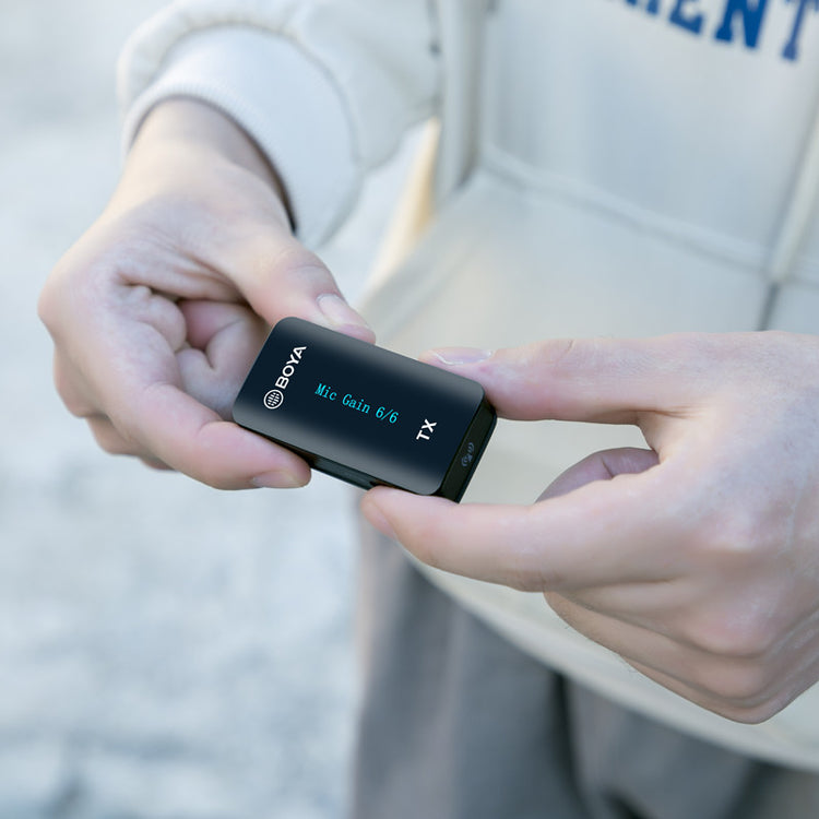 a person holding a small device
