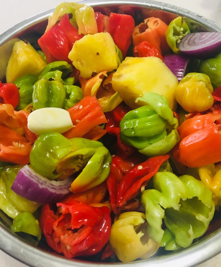 a bowl of colorful peppers