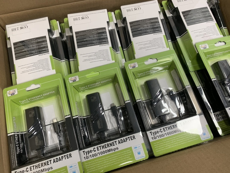 a group of black usb adapters in packaging