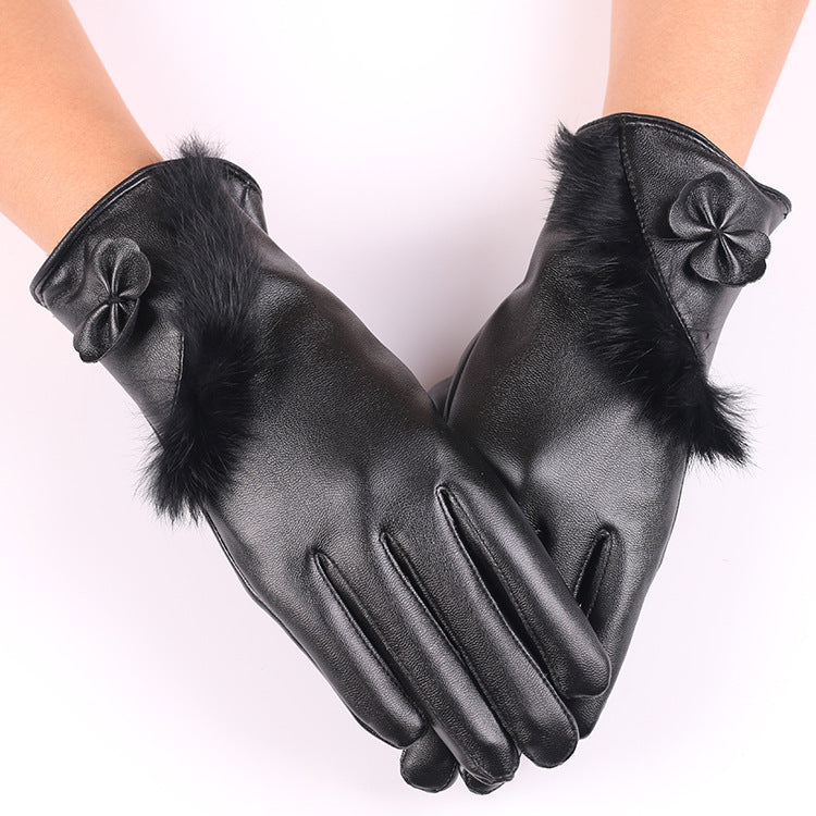 a pair of hands wearing black gloves