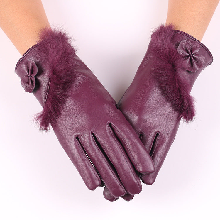a pair of hands wearing purple gloves