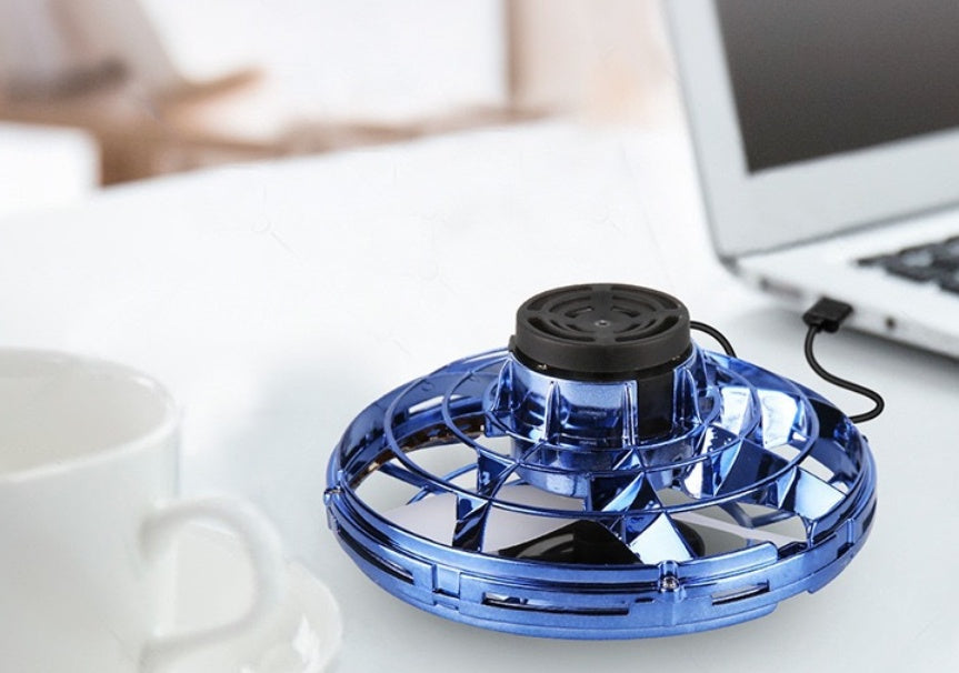 a blue fan on a white surface
