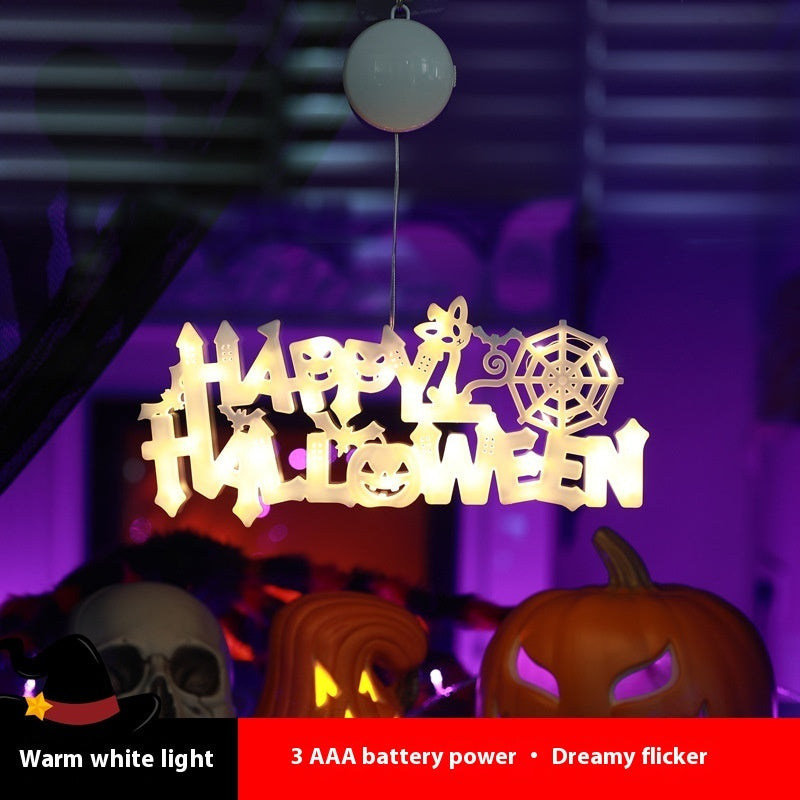 a white sign with a spider web and pumpkins