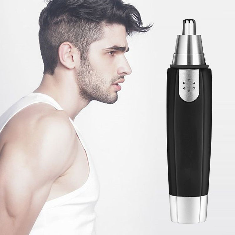 a man looking at a shaver