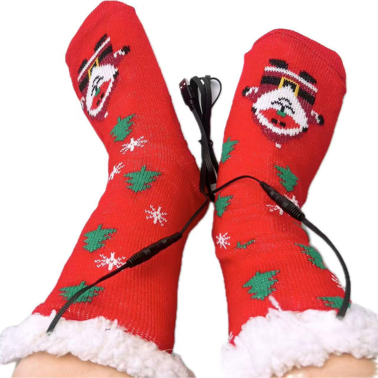 a pair of feet wearing red socks with a santa claus design