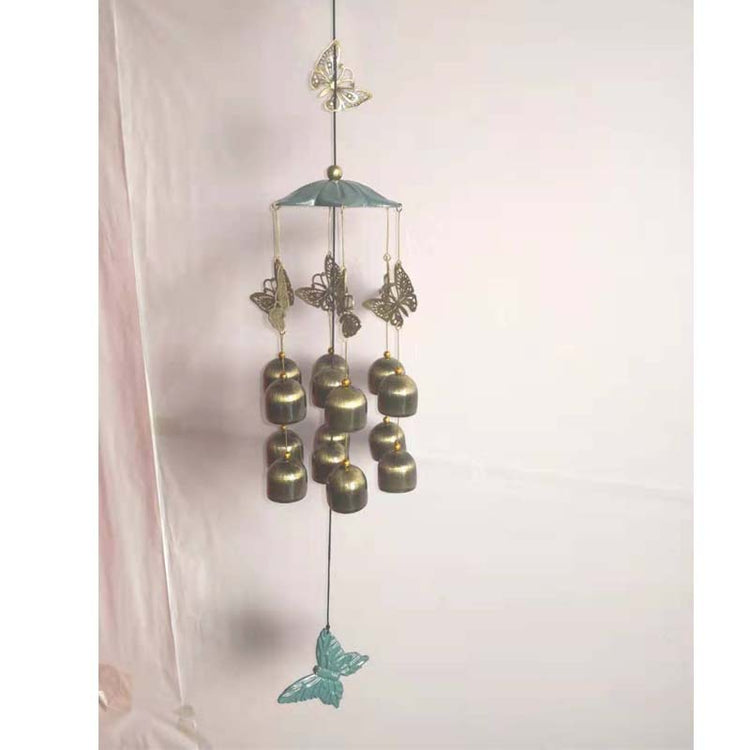 a wind chime with bells and butterflies