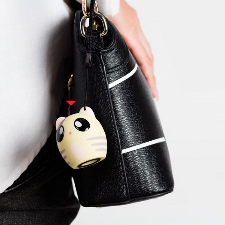 a handbag with a cat charm