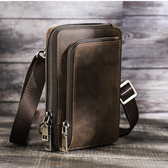 a brown leather bag with a strap