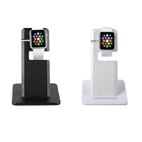 a couple of smart watches on a stand