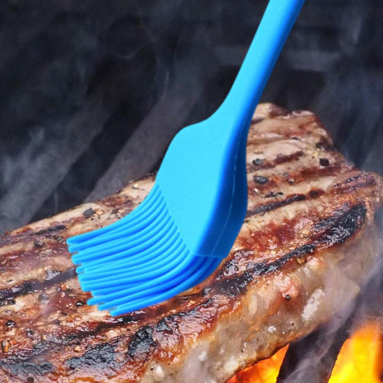 a blue brush on a piece of meat