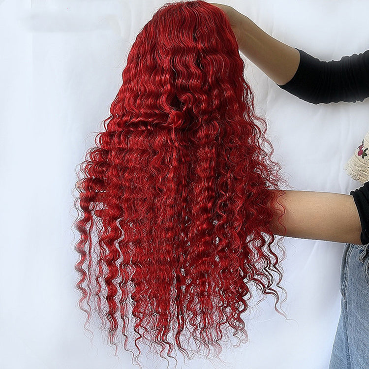 a person holding a wig