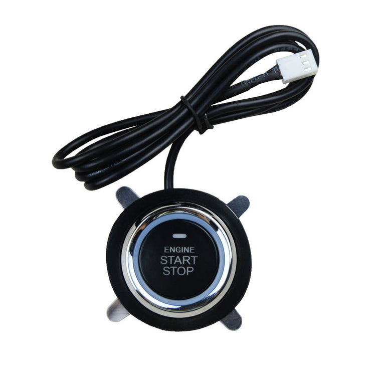 a black and silver start button with a wire