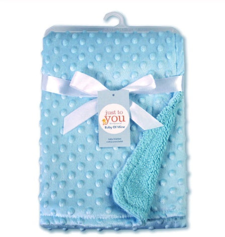 a blue blanket with a white bow