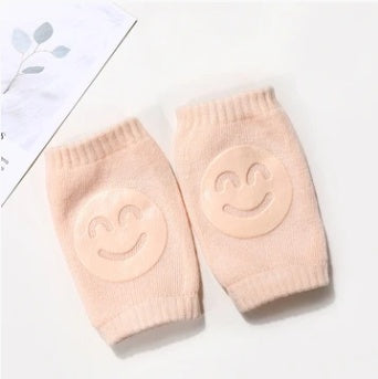 a pair of pink socks with smiley faces on them