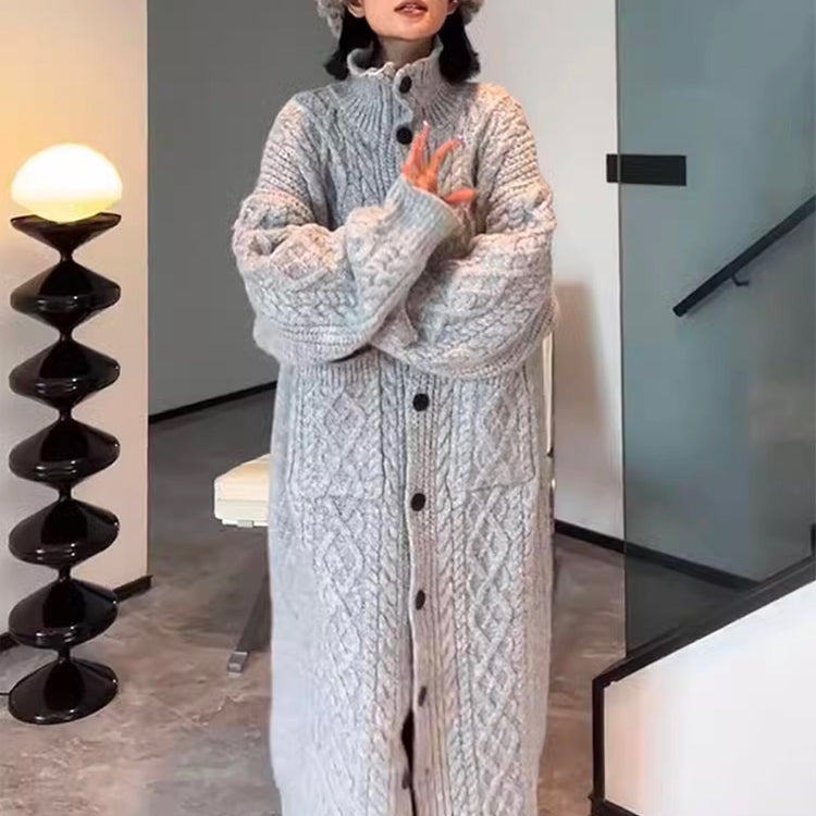 a woman wearing a knitted hat and long sweater