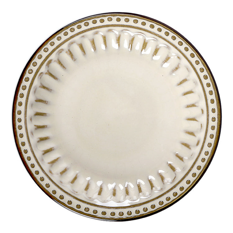 a white plate with gold trim