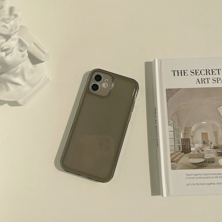 a phone and a book on a table