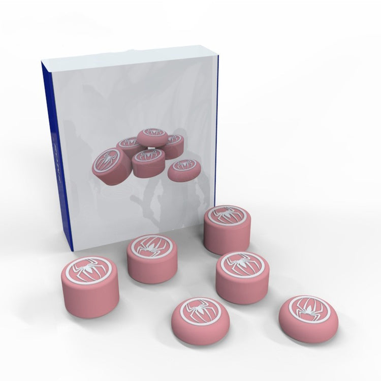 a group of pink round objects with white designs in a plastic case
