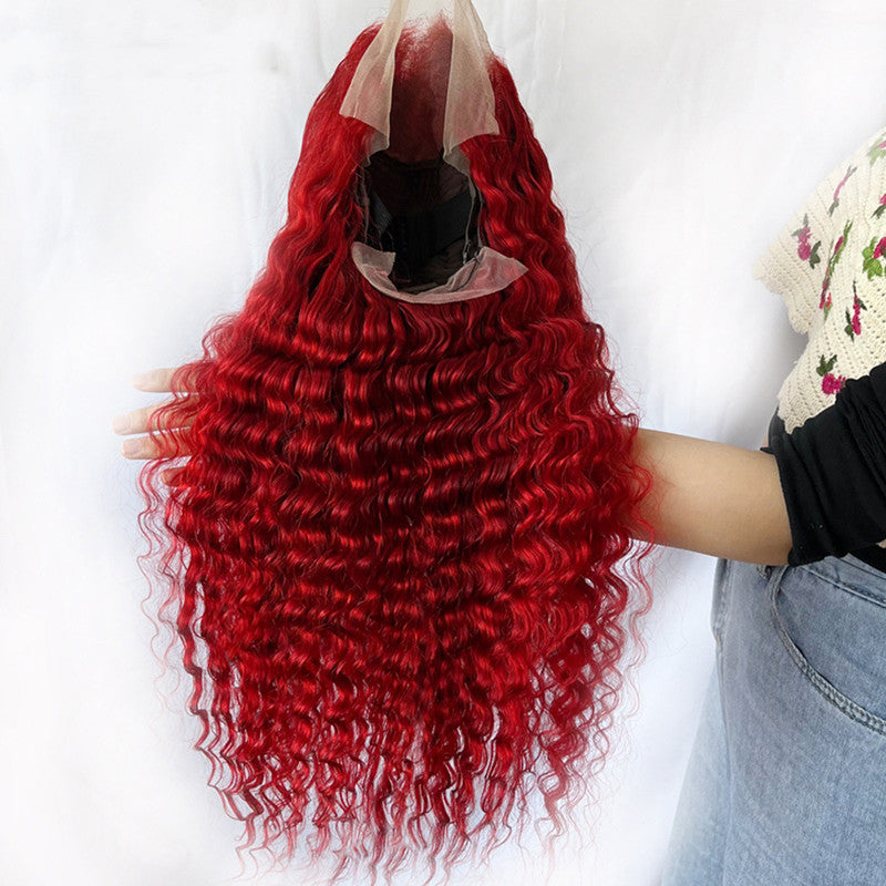 a person holding a wig