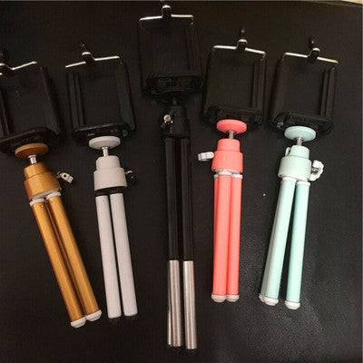 a group of selfie stick on a black surface