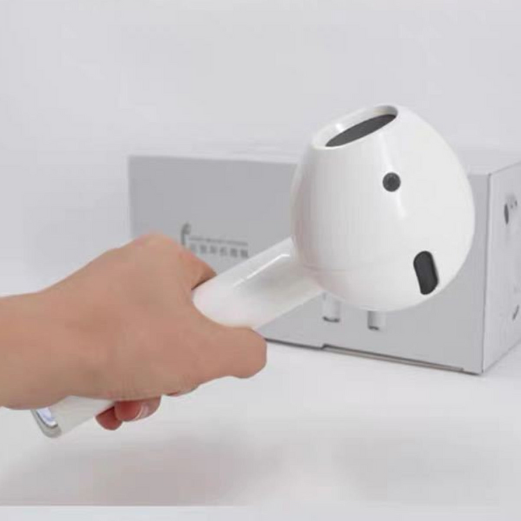 a hand holding a white object