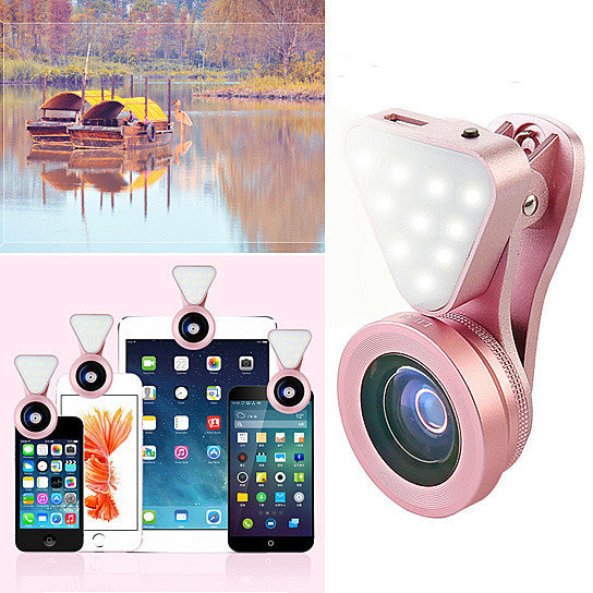 a pink camera with a lens and cell phones