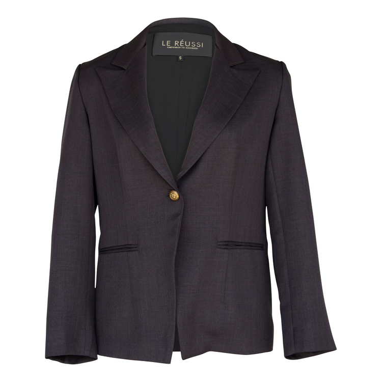 a black blazer with a gold button