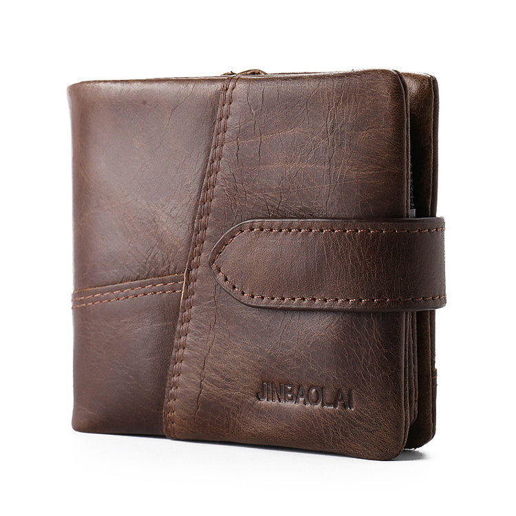 a brown leather wallet with a clip